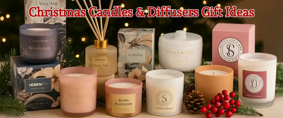 Christmas candles and diffusers arranged with festive décor, featuring warm glowing lights and seasonal scents perfect for holiday gifting.