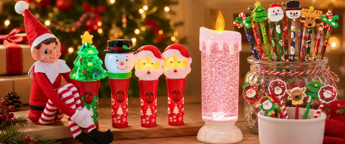 Christmas novelty gifts featuring a festive elf, light-up spinners, glitter candle, pencils and character-topped decorations.