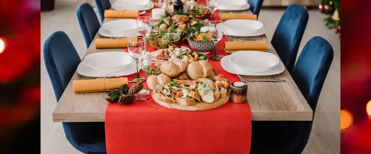 Christmas Table Cloths and Runners featuring festive seasonal patterns and decorative designs for creating a stylish Christmas dining table.