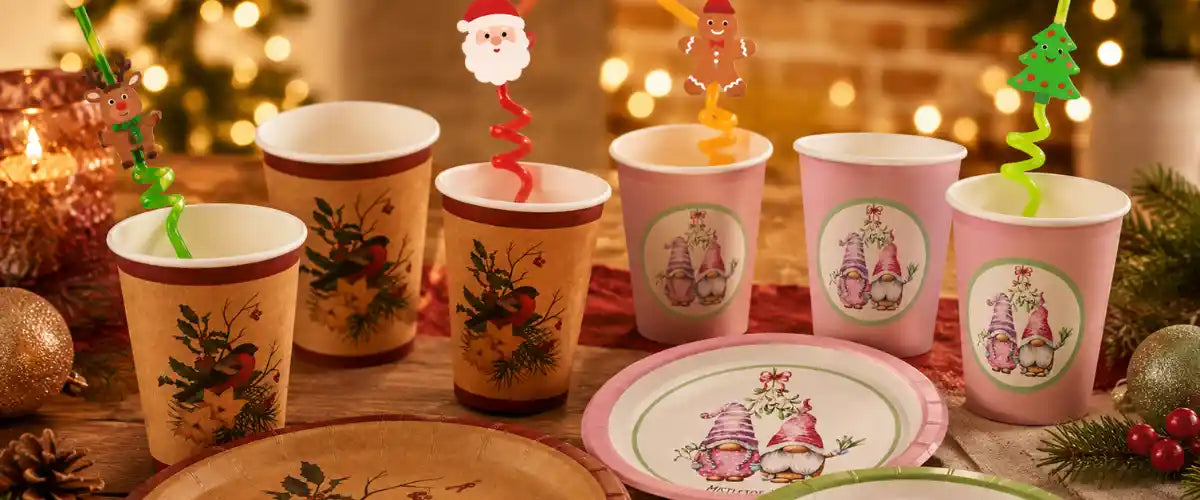 Christmas tableware collection with festive kraft and pastel gnome cups, matching plates, novelty straws, baubles and greenery.