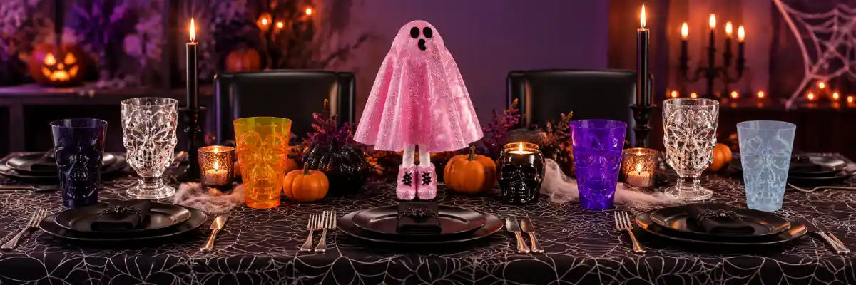 Halloween table and partyware featuring spooky plates, cups, candy bowls, drinkware, tablecloths and Halloween table decorations.