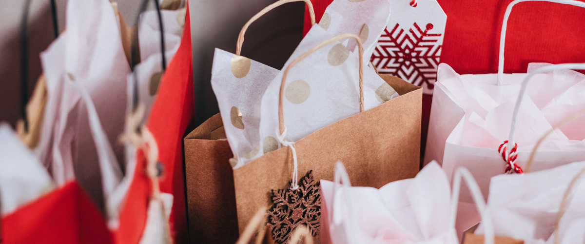 Christmas Gift Bags – assorted festive paper gift bags in various sizes and designs for holiday presents