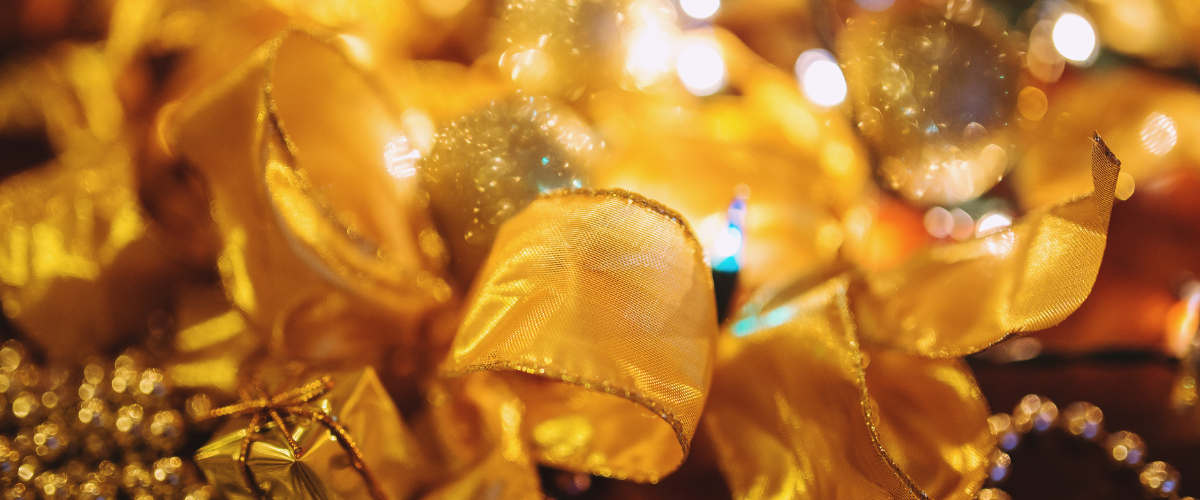 Assorted Christmas ribbons in red, gold, and green shades
