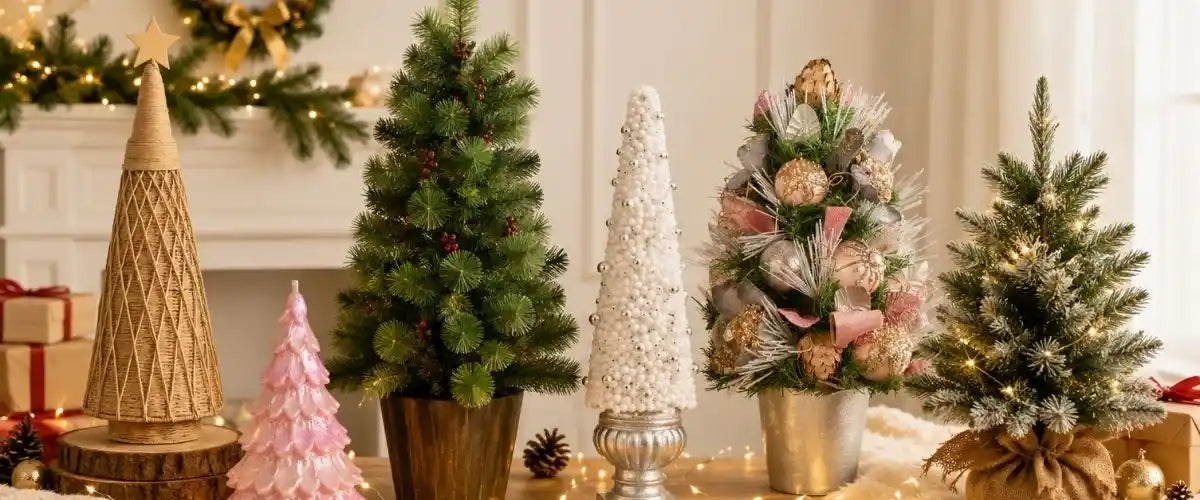 Tabletop and small artificial Christmas trees decorated with mini baubles and lights for compact festive displays in homes and offices.