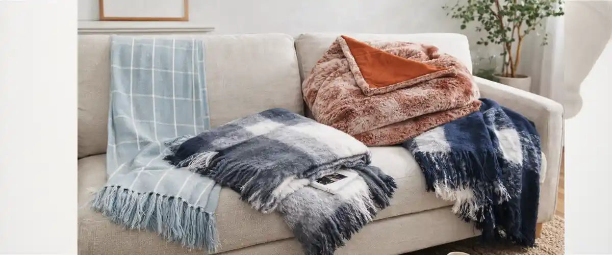 Winter throws collection featuring soft, cosy blankets and warm home essentials for comfortable cold-weather living.