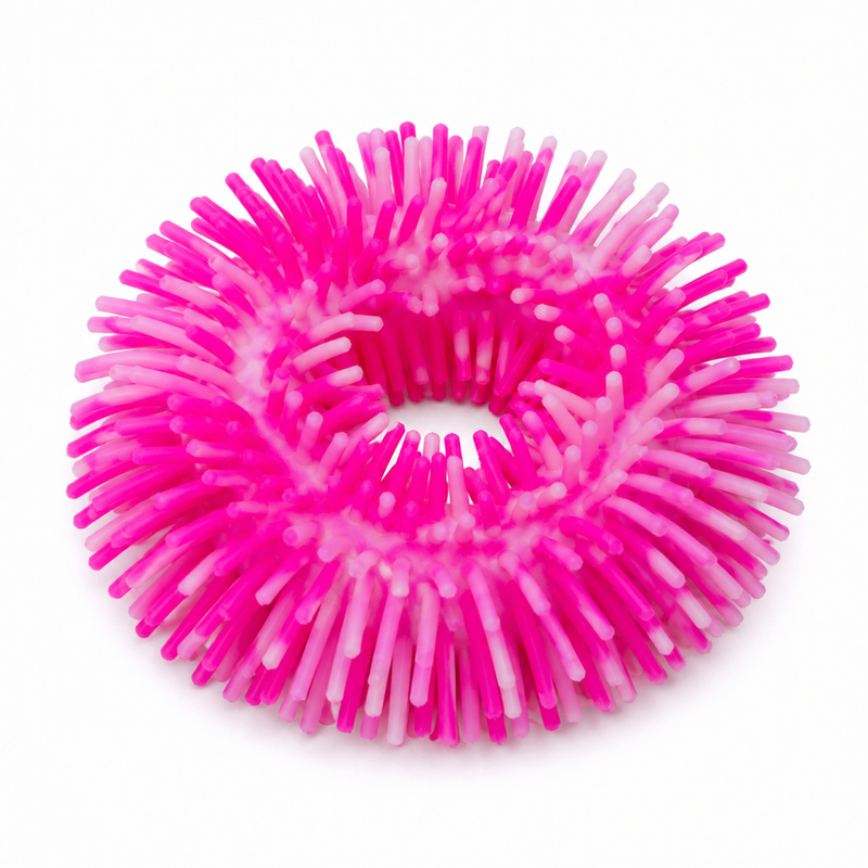 Pink and white textured ball on a white background. Squishy band bracelet 