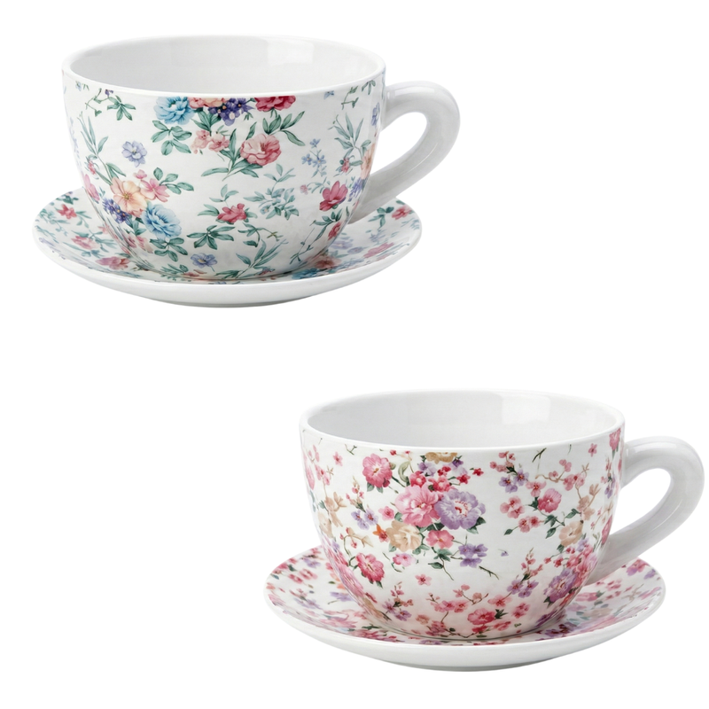 Two floral teacups and saucers on a white background
