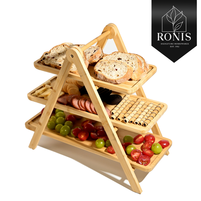 Three-tiered wooden serving tray with food on a white background, featuring the Ronis Signature Homeware.