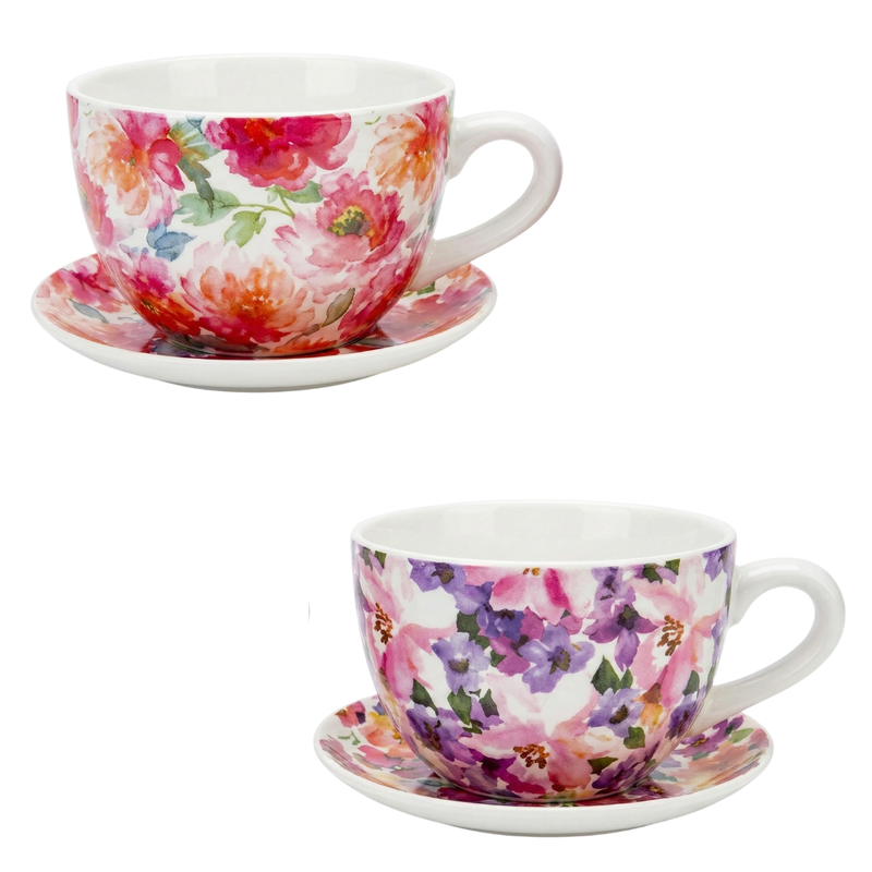 Two floral teacups and saucers on a white background