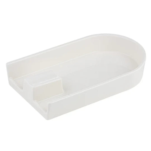 Sleek tong and spoon rest catching drips beside stove