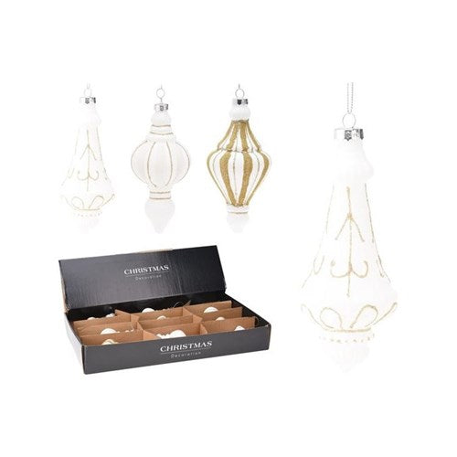 White glass ornament hanging from a tree