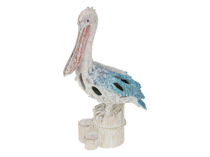 Pelican on log statue with coral design