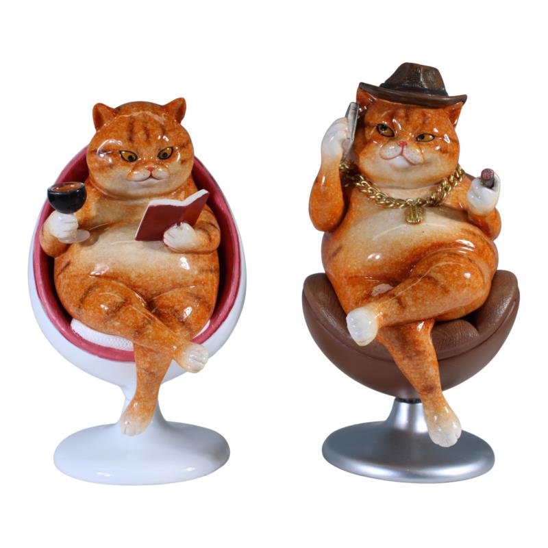 Assorted fat cats in swivel chair ornament