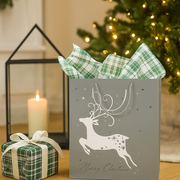 Medium silver Christmas gift bag with elegant deer design and luxe finish