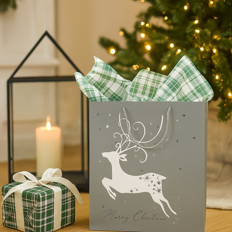 Medium silver Christmas gift bag with elegant deer design and luxe finish