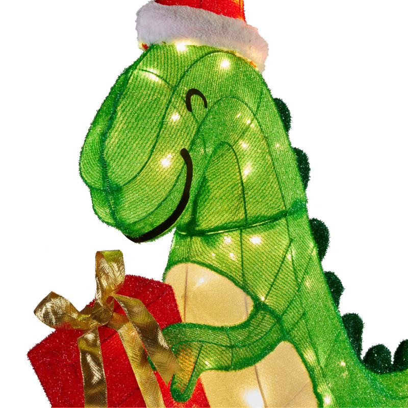 Christmas dinosaur decoration with Santa hat, holding a present, lit with LED lights, 90cm tall for indoor and outdoor use