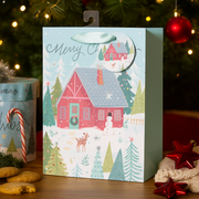 Small Christmas gift bag with festive red barn holiday design and rope handles