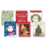 Medium Christmas gift bags with assorted festive designs made from FSC Mix paper