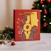 Large Christmas gift bag with bold “Joy” design and festive colors, 26x32.4x12.7cm