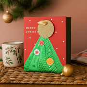 Small Christmas gift bag with festive tree design and red handles – 11.1x13.7x6.2cm