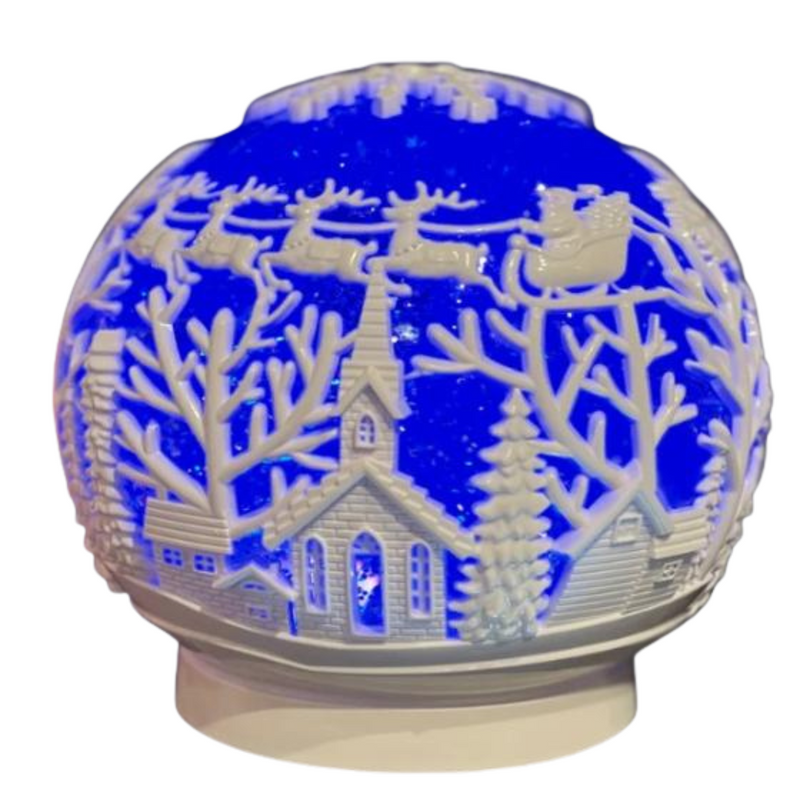 Christmas LED waterball with white church and swirling glitter inside illuminated snow globe