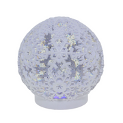 Christmas LED waterball featuring a white snowflake with swirling glitter and warm LED light