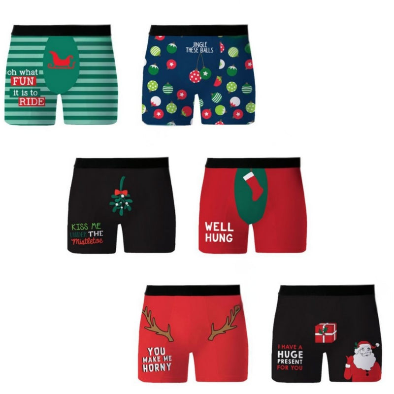 A set of eight men's Christmas-themed boxer briefs displayed on a plain white background, featuring various holiday prints including Santa, reindeer, ornaments, and humorous text.