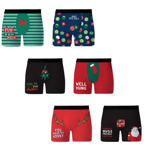 A set of eight men's Christmas-themed boxer briefs displayed on a plain white background, featuring various holiday prints including Santa, reindeer, ornaments, and humorous text.