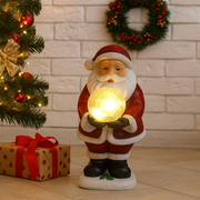 Christmas Santa figurine holding a glowing light-up snow globe with festive details