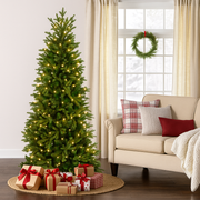 210cm Silverado Slim Christmas Tree with narrow profile and lush green branches, ideal for compact or elegant holiday setups
