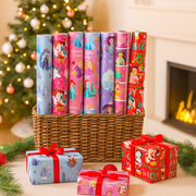 Assorted rolls of Disney Girl Christmas gift wrap featuring princesses and festive designs, 3m x 700mm