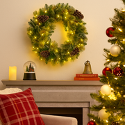 61cm gold Christmas wreath with glittery metallic foliage