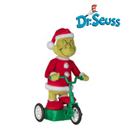 Dr. Seuss Grinch Musical Cruiser figurine with the Grinch riding a red scooter in a Santa suit, smiling mischievously.