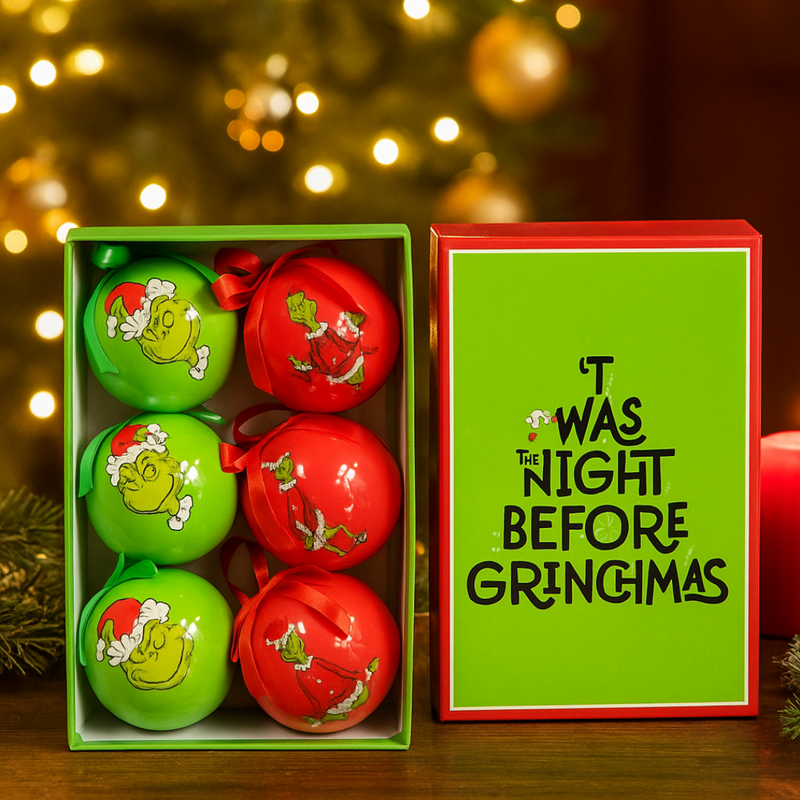 Set of 6 Grinch-themed Christmas baubles with festive designs, packaged in a Dr. Seuss holiday gift box.