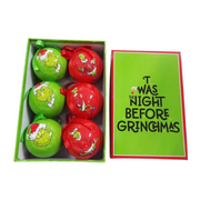 Set of 6 Grinch-themed Christmas baubles with festive designs, packaged in a Dr. Seuss holiday gift box.