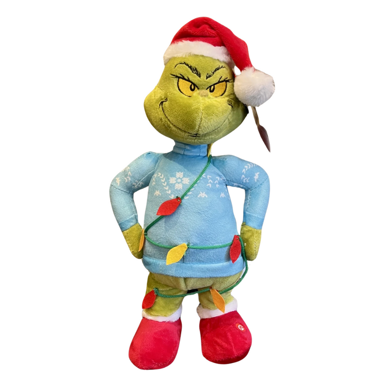 Small animated Grinch figure in blue sweater tangled in Christmas lights, side-stepping motion