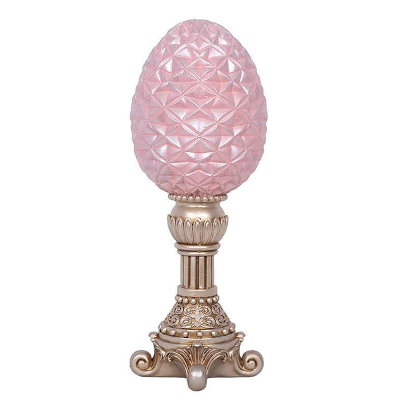 Pink polyresin egg on stand decoration