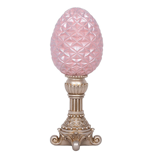 Pink polyresin egg on stand decoration