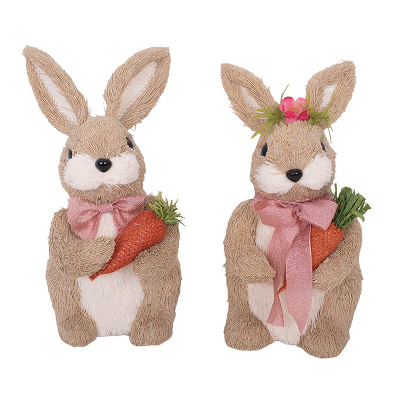 Pair of dressed bunny figurines