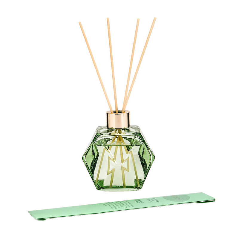 Green bottle dispensing Passion Flower fragrance