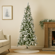 Frosted Colonial Slim Christmas Tree 229cm tall with snow-covered branches, perfect for small spaces and elegant holiday décor.
