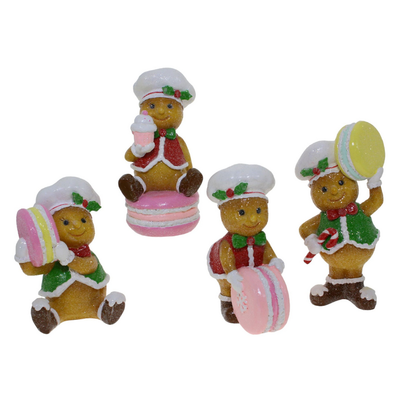 Assorted gingerbread macaron decorations with frosting, sprinkles, and festive colors