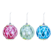 Three colorful Christmas ornaments with lattice designs on a white background