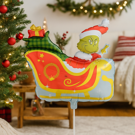 64x77cm Foil Balloon featuring a green monster in a sleigh filled with presents, perfect for fun Christmas party decorations.