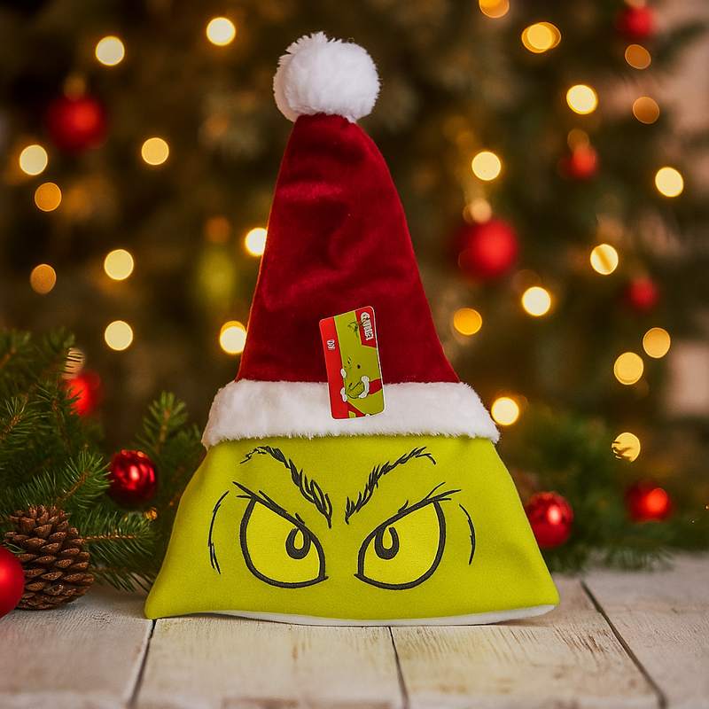 Grinch with oversized eyes wearing a Santa hat, festive holiday decoration or plush