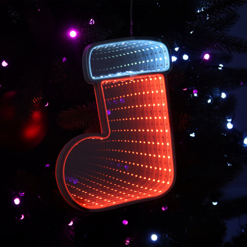 Infinity mirror Christmas boot with glowing LED lights hanging on a holiday-themed wall