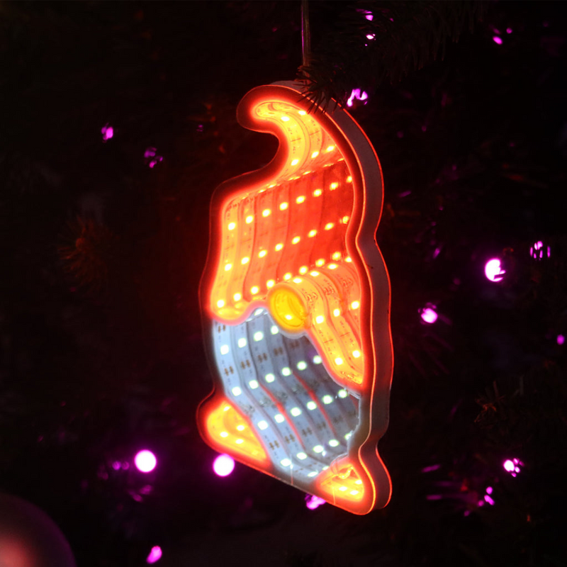 Infinity mirror Christmas gonk decoration glowing with LED lights hanging on a festive wall