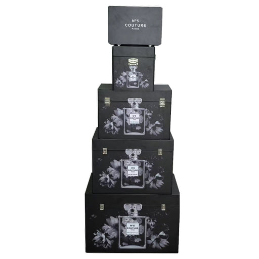 A set of five nesting storage trunks featuring chic Couture fashion designs.