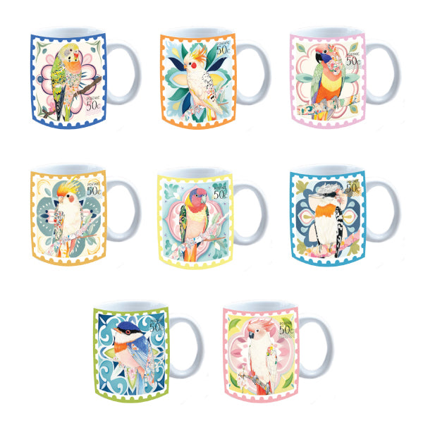 A colorful Rainbow Australiana ceramic mug shown next to its brown gift box.