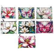Assorted cosmetic bags featuring various beautiful Magnolia floral illustrations. – thumbnail